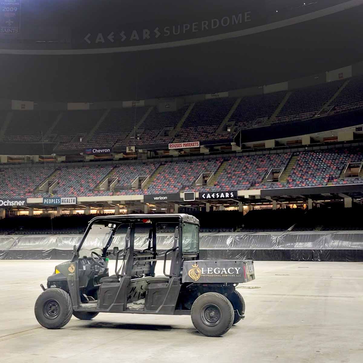 Legacy's utility golf cart on the grounds of the Caesars Superdome